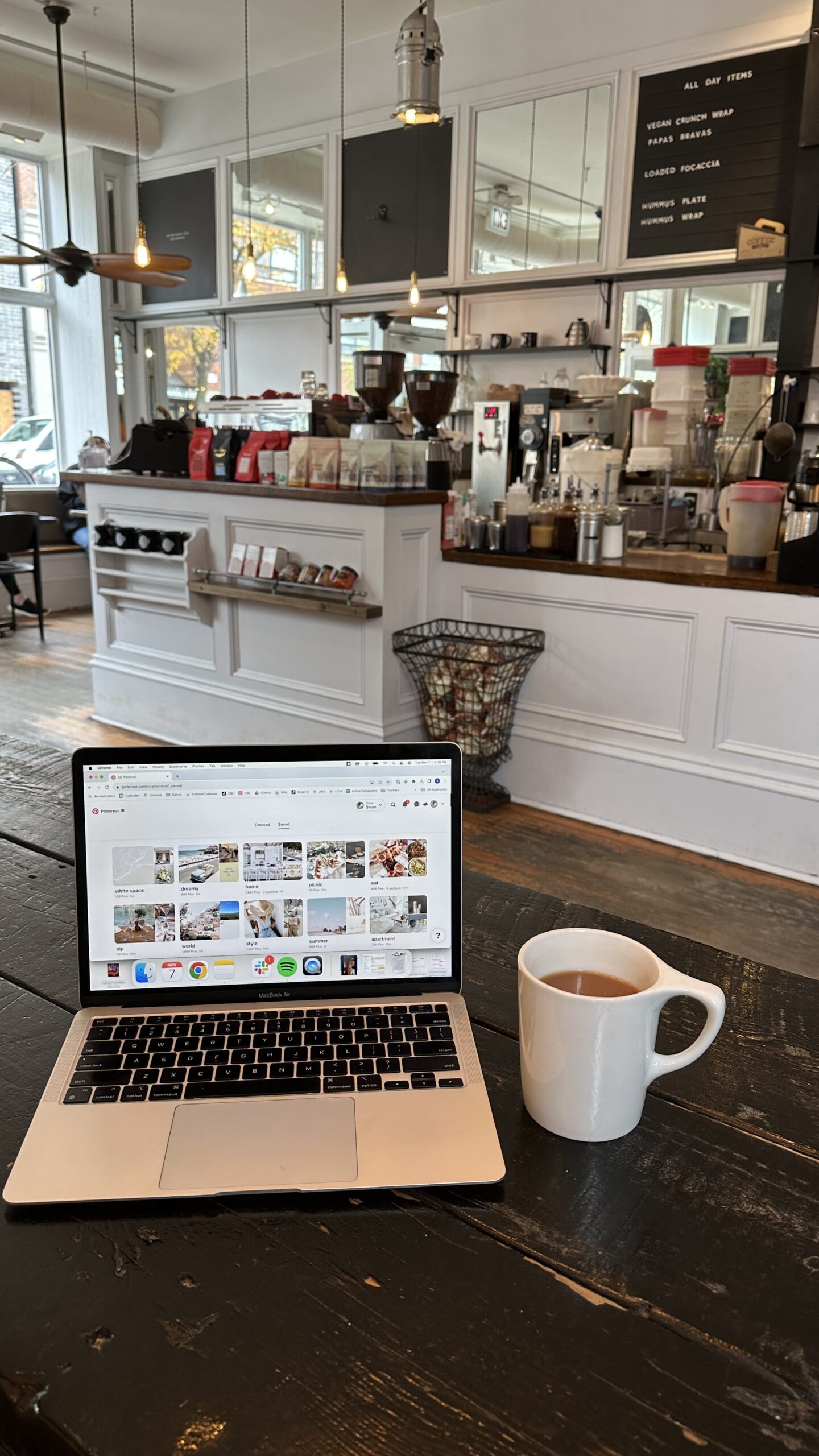 A small business owner figuring out the cost of web design at a local coffee shop.